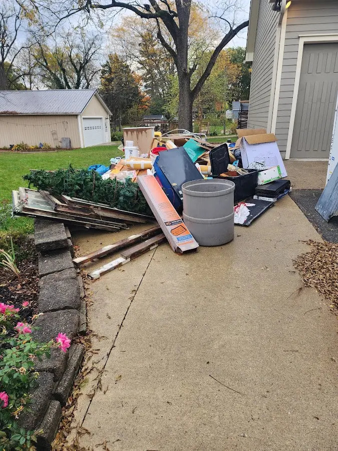 Dumpster being loaded with debris for 3 Yard Dumpster Rental in Allenstown